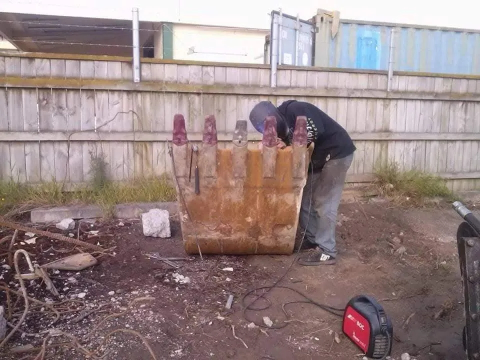 Rebuilding a worn excavator bucket on site